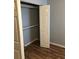 Bedroom closet with ample storage space and laminate flooring at 1550 11Th Ne St # A2, Winter Haven, FL 33881