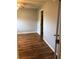 Bedroom with modern flooring, light walls, ceiling fan and closet access at 1550 11Th Ne St # A2, Winter Haven, FL 33881