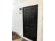 Apartment A2 has a solid black door on the exterior with a light fixture above at 1550 11Th Ne St # A2, Winter Haven, FL 33881