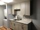 Laundry room view highlighting cabinets, counter space, and a washer/dryer unit at 1550 11Th Ne St # A2, Winter Haven, FL 33881