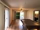 Spacious living room offers natural light, access to the patio, and a view of the bathroom at 1550 11Th Ne St # A2, Winter Haven, FL 33881