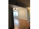 Living Room features new laminate flooring, grey walls, ceiling fan, and a bright window at 1550 11Th Ne St # A2, Winter Haven, FL 33881