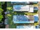 Aerial view showcases the home's roof, landscaping, and proximity to the waterway at 167 Bonnie Dr, Auburndale, FL 33823