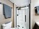 Bathroom featuring a sleek glass-enclosed shower with matte black fixtures and a modern design at 167 Bonnie Dr, Auburndale, FL 33823