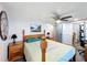 Bedroom featuring a wooden bed, ceiling fan, and gray door, offering a peaceful home space at 167 Bonnie Dr, Auburndale, FL 33823