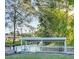 Covered boat dock on canal with lush landscaping at 167 Bonnie Dr, Auburndale, FL 33823