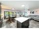 Open-concept dining area with wood-look flooring, and an abundance of natural light at 167 Bonnie Dr, Auburndale, FL 33823