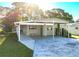 Charming single-story home with a covered carport and a well-manicured front yard at 167 Bonnie Dr, Auburndale, FL 33823