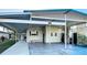 Home featuring carport for parking with decorative lattice trim, tidy yard and easy access at 167 Bonnie Dr, Auburndale, FL 33823