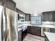 Well-lit kitchen showcasing modern appliances, granite countertops, and sleek cabinetry at 167 Bonnie Dr, Auburndale, FL 33823