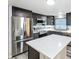 Spacious kitchen equipped with stainless appliances, a center island, and ample counter space at 167 Bonnie Dr, Auburndale, FL 33823