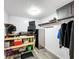 Office space equipped with multiple computer monitors, shelving, and storage cabinets at 167 Bonnie Dr, Auburndale, FL 33823