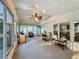 Inviting sunroom featuring comfortable seating, and access to the outdoors at 167 Bonnie Dr, Auburndale, FL 33823