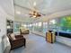 Bright sunroom with lots of natural light, comfortable seating, and views of the outdoors at 167 Bonnie Dr, Auburndale, FL 33823