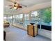 Bright sunroom with panoramic windows, offering scenic views and plenty of natural light at 167 Bonnie Dr, Auburndale, FL 33823