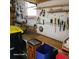 Functional workshop area featuring a workbench, shelving, and tool storage for efficient organization at 167 Bonnie Dr, Auburndale, FL 33823