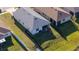 Aerial view of the property showcasing the backyard, fence lines, and proximity to neighboring homes at 169 Summershore Dr, Auburndale, FL 33823