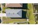 Aerial view of home showing roof, fencing, and proximity to water at 169 Summershore Dr, Auburndale, FL 33823
