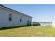 Spacious backyard with lake view and black metal fence, offering privacy and serene scenery at 169 Summershore Dr, Auburndale, FL 33823