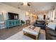 Comfortable living room featuring stylish decor, a TV, and an open layout connecting to the kitchen and dining areas at 169 Summershore Dr, Auburndale, FL 33823