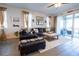 Comfortable living room featuring hardwood floors, stylish furniture and bright natural light at 169 Summershore Dr, Auburndale, FL 33823
