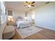 Inviting main bedroom with neutral tones, a patterned rug, and natural light from two windows at 169 Summershore Dr, Auburndale, FL 33823