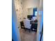 Charming home office nook with floral wallpaper, modern desk, and bright natural light at 169 Summershore Dr, Auburndale, FL 33823