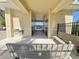 Pool house entrance with benches, restrooms, and drinking fountain for convenience at 169 Summershore Dr, Auburndale, FL 33823
