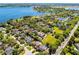 Gorgeous aerial view showcasing the community's mature trees, lake access, and beautifully landscaped lawns at 2 Bridgewater Dr, Winter Haven, FL 33884