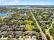 Breathtaking aerial shot of the community, showcasing its desirable location with mature trees and lake views at 2 Bridgewater Dr, Winter Haven, FL 33884