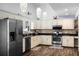 A kitchen featuring stainless steel appliances, granite countertops, and ample cabinet space at 2 Bridgewater Dr, Winter Haven, FL 33884