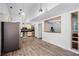 Open kitchen area features plank flooring and breakfast bar, a cozy and inviting space at 2 Bridgewater Dr, Winter Haven, FL 33884