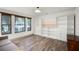 Inviting living room with large windows and built-in shelving for ample storage at 2 Bridgewater Dr, Winter Haven, FL 33884