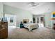 Large main bedroom features vaulted ceilings, carpet and a fireplace at 2 Bridgewater Dr, Winter Haven, FL 33884
