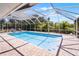 Screened-in pool featuring ample deck space for entertaining with a clear blue sky overhead at 2 Bridgewater Dr, Winter Haven, FL 33884