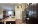Open-concept kitchen featuring a large island with seating, stainless steel appliances, and dark wood cabinetry at 214 Brook Ln, Polk City, FL 33868