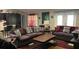 Open-concept living room with plush sofas, coffee table, and decorative accents at 214 Brook Ln, Polk City, FL 33868