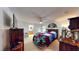 A bedroom with ceiling fan and decor at 217 Kent Ct, Haines City, FL 33844