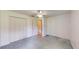 Bedroom with closet and door with white walls and blue carpet at 217 Kent Ct, Haines City, FL 33844