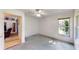 Cozy bedroom with natural light and a door leading to a living area at 217 Kent Ct, Haines City, FL 33844
