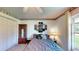 Bedroom featuring a plush bed, closet, window and wall decor at 217 Kent Ct, Haines City, FL 33844