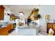 Well-lit kitchen featuring granite countertops, modern appliances, ample cabinet space, and a functional island at 217 Kent Ct, Haines City, FL 33844