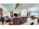 Open-concept living room connected to the dining area, featuring a vaulted ceiling, and neutral carpeting at 217 Kent Ct, Haines City, FL 33844