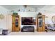 Cozy living room with a large flat-screen TV, built-in cabinets, and comfortable seating, perfect for relaxation at 217 Kent Ct, Haines City, FL 33844