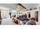Open-concept living room featuring high ceilings, a ceiling fan, and seamless flow to the kitchen and dining areas at 217 Kent Ct, Haines City, FL 33844