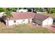 Aerial view of a single-story home with a red tile roof and attached garage at 218 Omaha St S S St, Lake Hamilton, FL 33851