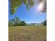 Large lot with views of the lake, mature trees, and expansive green lawn space at 218 Omaha St S S St, Lake Hamilton, FL 33851