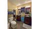 Cozy bathroom with double sinks, dark wood cabinetry and slate tile floors at 218 Omaha St S S St, Lake Hamilton, FL 33851