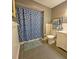 Bright bathroom featuring tile floors, a shower and a storage rack at 218 Omaha St S S St, Lake Hamilton, FL 33851