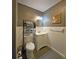 Compact bathroom featuring tile floors, storage rack and a vanity at 218 Omaha St S S St, Lake Hamilton, FL 33851